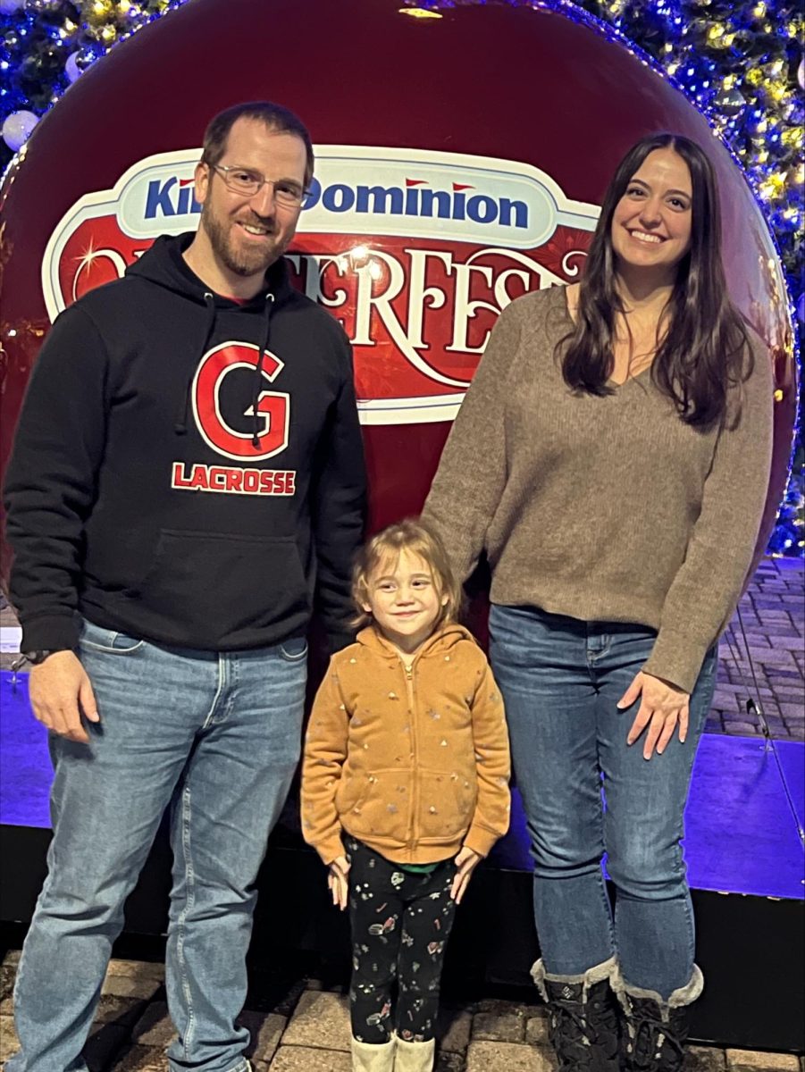 Coach McMahon (left) with his wife and daughter